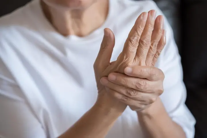 Individuals with hand pain from diabetic neuropathy, a condition studied with ARA-290 peptide for nerve repair.