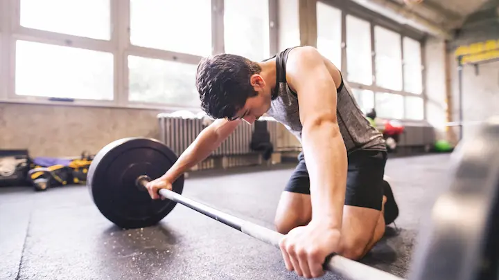 Heavy barbell training creates mechanical tension for muscle hypertrophy, while muscle building peptides amplify growth and recovery signals.